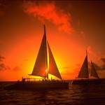 Pôr-do-sol com veleiros em Aruba